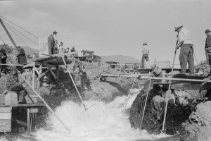 Columbia River Indians fishing from scaffolds at Celilo Falls