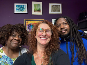 three people smiling 