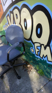A chair in front of the KBOO studios