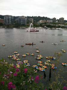 Reclaiming the Willamette dozens of people floating in inflatable rings in a river