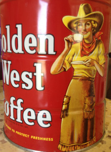 Picture of a vintage tin of Golden West Coffee with a red background and a cowgirl sipping coffee