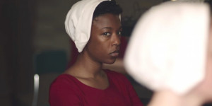 Samira Wiley in Handmaid Costume: red dress, white hair covering