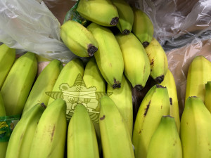 A bunch of bananas with the Self Help Radio logo on the,
