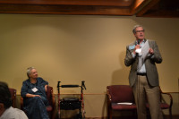 Tom Burns (standing), former head of the Oregon Medical Marijuana Program, and Sandee Burbank (seated), founder the director of Mothers Against Misuse and Abuse